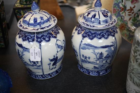 A pair of Chinese blue and white baluster jars and covers, late 19th century 28.5cm, both repaired